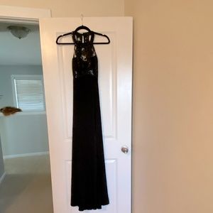 Sequin Hearts black formal floor length gown with open back and subtle slit